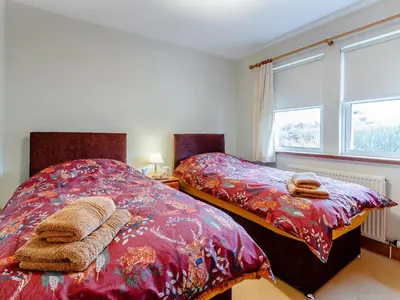 two beds sitting next to each other in a bedroom at Cairn-O-Mhor in Lendalfoot