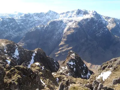 a view of a mountain range with snow covered mountains at Sea Otter Cottage in Appin