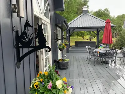 a porch with a table and a gazebo at Little Fox Lodge Luxury Hideaway with Hot Tub Glencoe Near Fortwilliam in Glencoe