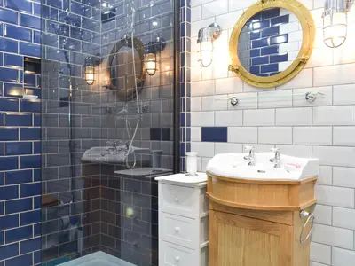 a bathroom with a sink and a mirror at 4 Dolphins in Connel