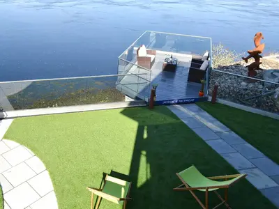 a rendering of a house with a view of the water at 4 Dolphins in Connel