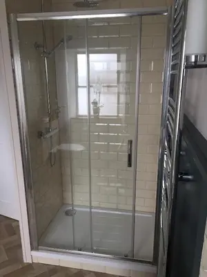 a shower with a glass door in a bathroom at Black Bull Gartmore in Stirling