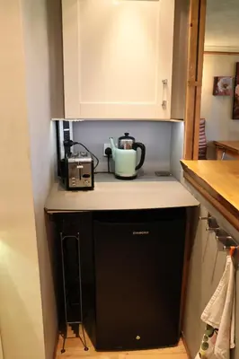 a kitchen counter with a coffee maker and a toaster at The Retreat Tranquil Countryside Apartment in Larkhall