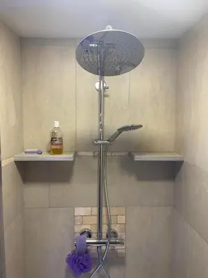a shower with a shower head in a bathroom at The Retreat Tranquil Countryside Apartment in Larkhall