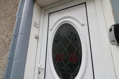 a door with a stained glass window on it at Macintosh lower in Bellshill