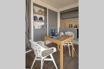 a dining room with a wooden table and chairs at Columba Lodge, St Conan's Escape, Idyllic highland getaway in Dalmally