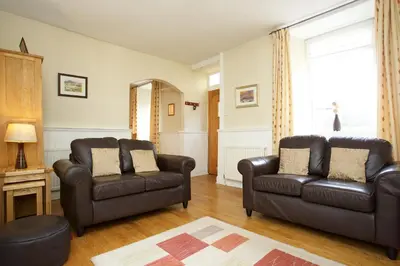 a living room with two chairs and a couch at Avonlea Self-Catering in Crieff