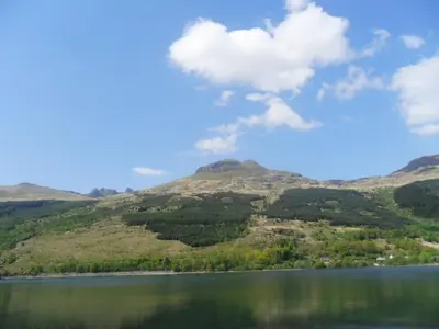 a view of a lake with mountains in the background at Ben Arthur's Bothy Luxury Flat in Arrochar