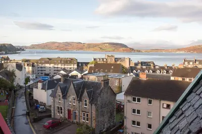 an aerial view of a city with a body of water at Hawthornbank in Oban