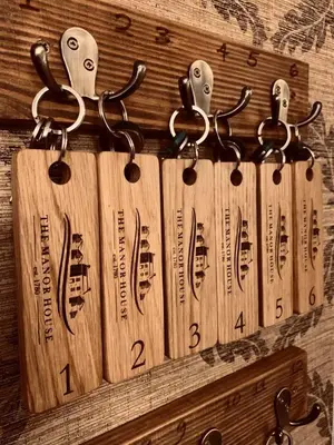 a group of wooden baseball bats hanging on a wall at The Manor House in Oban
