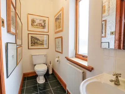 a bathroom with a toilet and a sink at Torview House in Peebles
