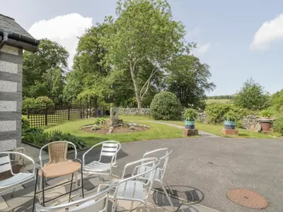 a group of chairs sitting on a patio at Torview House in Peebles