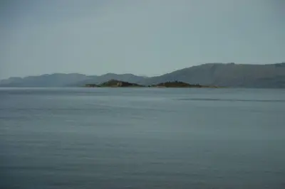 a large body of water with mountains in the background at Mingulay, Cuil Bay in Appin