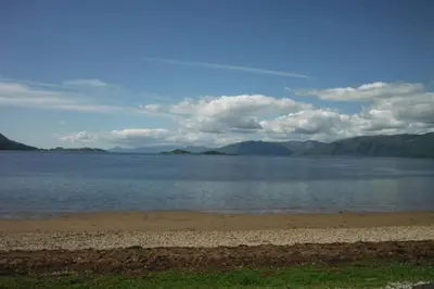 a large body of water with mountains in the background at Mingulay, Cuil Bay in Appin