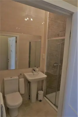 a bathroom with a toilet and a sink and a shower at Old Town 163 in Edinburgh