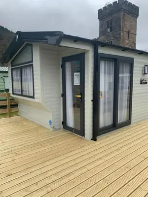 a house with a door on a deck at The Castleton Sea View 13 in Dunoon