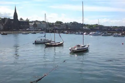 a group of boats are docked in a harbor at Sunny House with views to Edinburgh Skyline in Edinburgh