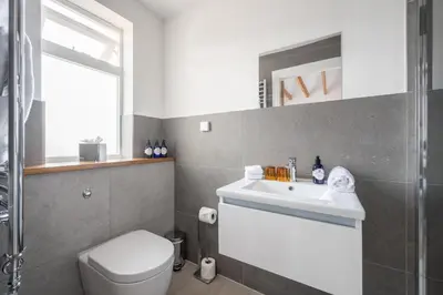 a bathroom with a toilet and a sink at Ardeonaig Hotel & Restaurant in Ardeonaig