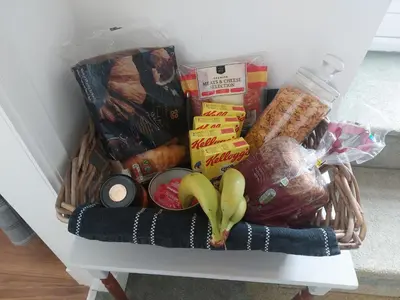 a basket filled with food on a table at THE BOTHY SUITE BY TEMPLE WOOD in Lochgilphead