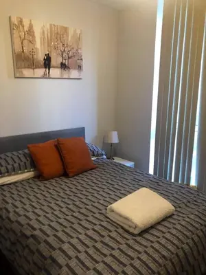 a bedroom with a bed with two pillows on it at Dreamhouse at Oswald Street, City Centre in Glasgow