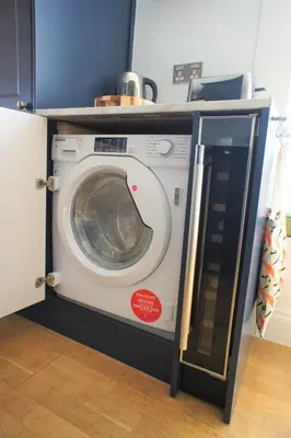 a washing machine with its door open in a room at 136 West Princes Street in Helensburgh