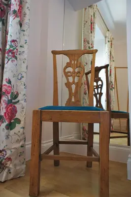a wooden chair with a blue seat in a room at 136 West Princes Street in Helensburgh