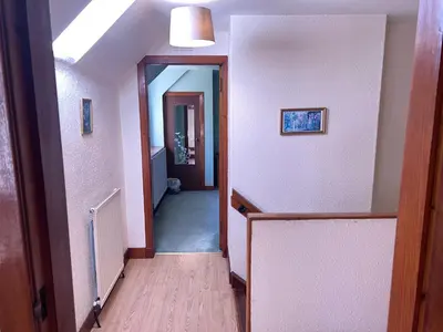 a hallway with a hallway leading into a room at The Maid's House in Lanark
