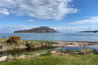 an island in the middle of a body of water at Lamlash- Self catering accommodation with seaviews in Lamlash