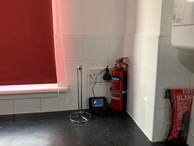 a room with a fire hydrant in the corner of a wall at Dada House in Glasgow