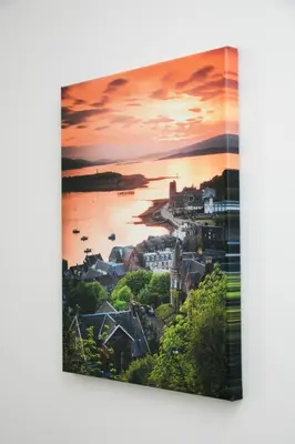 a painting of a sunset over a harbor at McCaig's Way in Oban