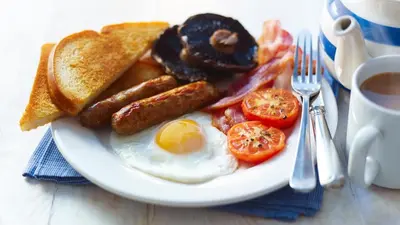 a plate of breakfast food with eggs bacon tomatoes and toast at North West Castle Hotel in Stranraer