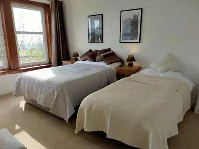 a bedroom with two beds and a window at Buckieburn - self-catering - rural in Stirling