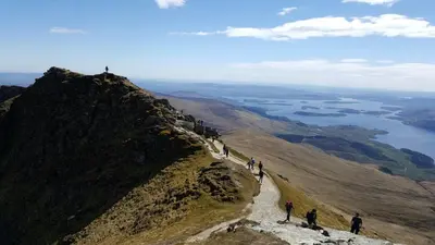 a group of people standing on top of a mountain at Braeside Guest House, Loch Lomond in Drymen