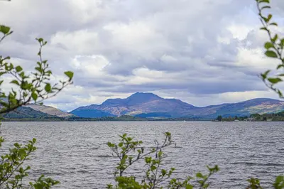 a large body of water with mountains in the background at Fantastic Cottage in Loch Lomond National Park in Alexandria