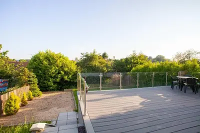 a patio with a fence and a table and chairs at Beautifully Designed Pollok House in Glasgow