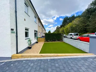a yard with a lawn in front of a house at Beautifully Designed Pollok House in Glasgow