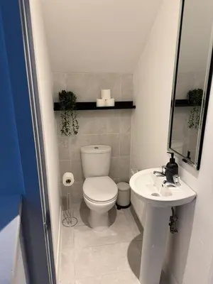 a small bathroom with a toilet and a sink at Beautifully Designed Pollok House in Glasgow