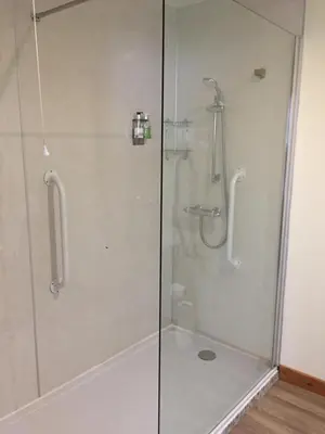 a shower with a glass door in a bathroom at Corran Bunkhouse in Onich