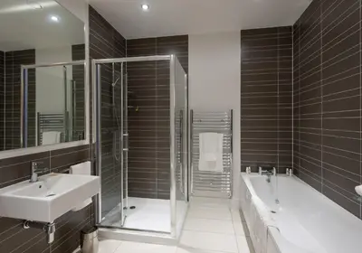 a bathroom with two sinks and a shower and a tub at Shandwick Apartment - Edinburgh City Centre - Sleeps 2 in Edinburgh