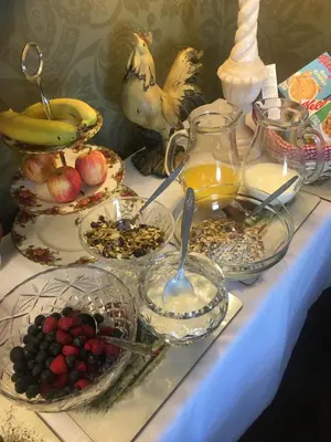 a table with a bunch of food and fruit on it at Auchenlea bed and breakfast in Coatbridge