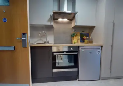 a kitchen with a sink and a stove at iQ Grove Accomodation in Edinburgh in Edinburgh