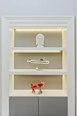 a toy airplane is sitting on a shelf at Ultra Modern, West End Village, Refurbished basement appt in Edinburgh