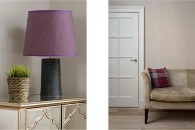 a purple lamp sitting on a table next to a chair at The Rose Street Retreat by Calton Living in Edinburgh