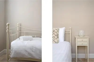 a bedroom with a bed and a side table at The Rose Street Retreat by Calton Living in Edinburgh