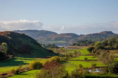 a view of a valley with a river and mountains at 5 bed house near Oban in Oban