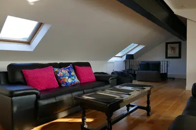 a living room with a couch and a coffee table at The Annexe at Loch View Farm in Crieff