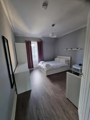 a large room with a bed and a window at No7 Oban Harbour in Oban