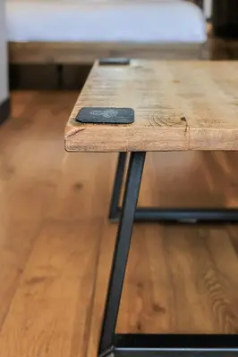 a wooden picnic table with a blackinylinylinylinylinylinylinylinylinyl at Oban Bay Apartments in Oban