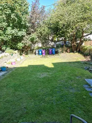 a yard with a lawn with a group of rubbish at Carrick - One Bed Apartment in Largs