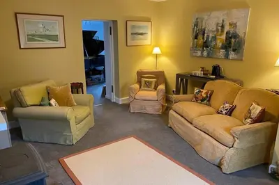 a living room with two couches and two chairs at 2x King Bedrooms, private living room & bathroom in Thornhill